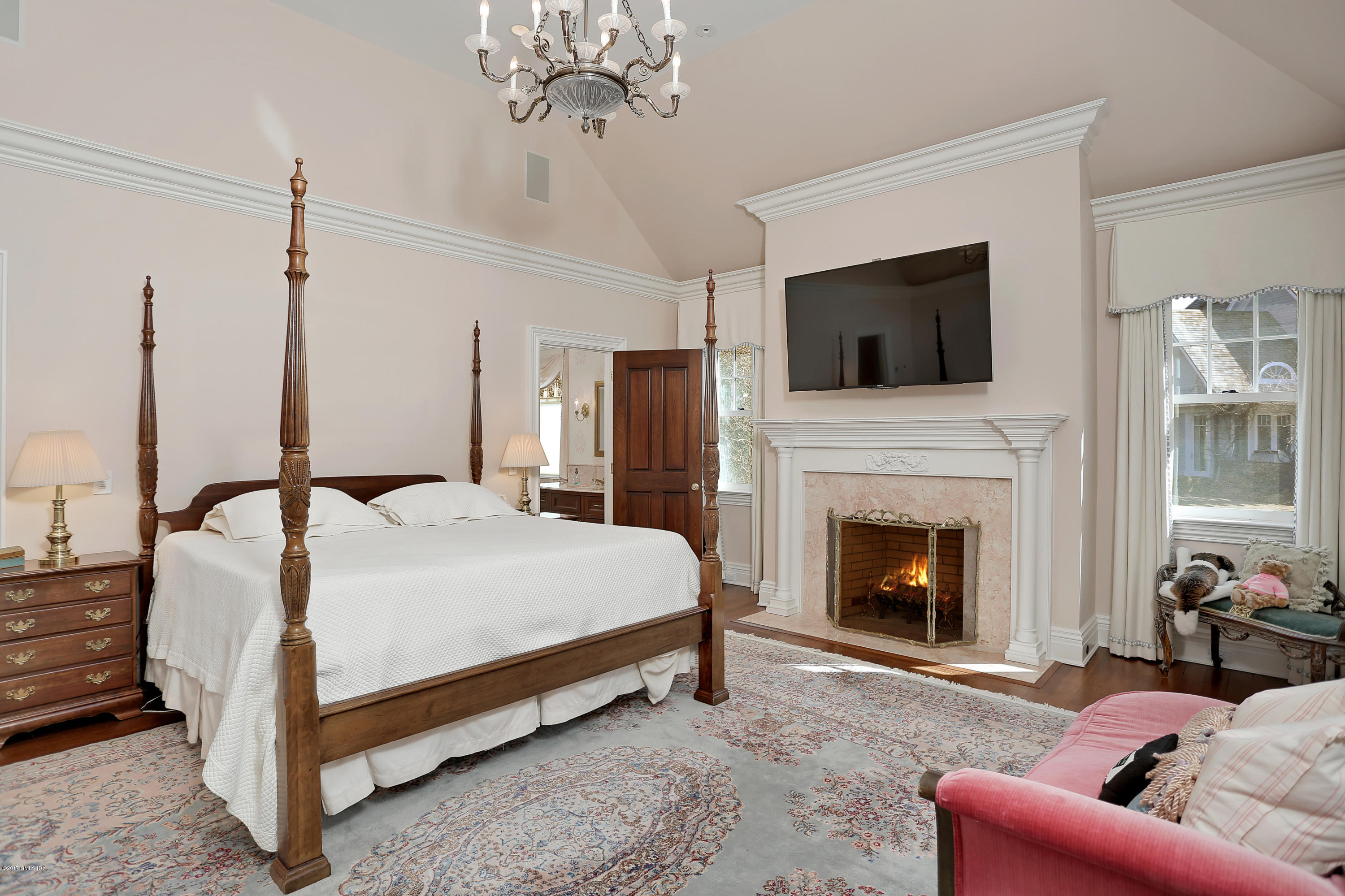 41 Leeward Lane Riverside, CT 06878 - Photo 15 of 27 a bed room with a bed and a television