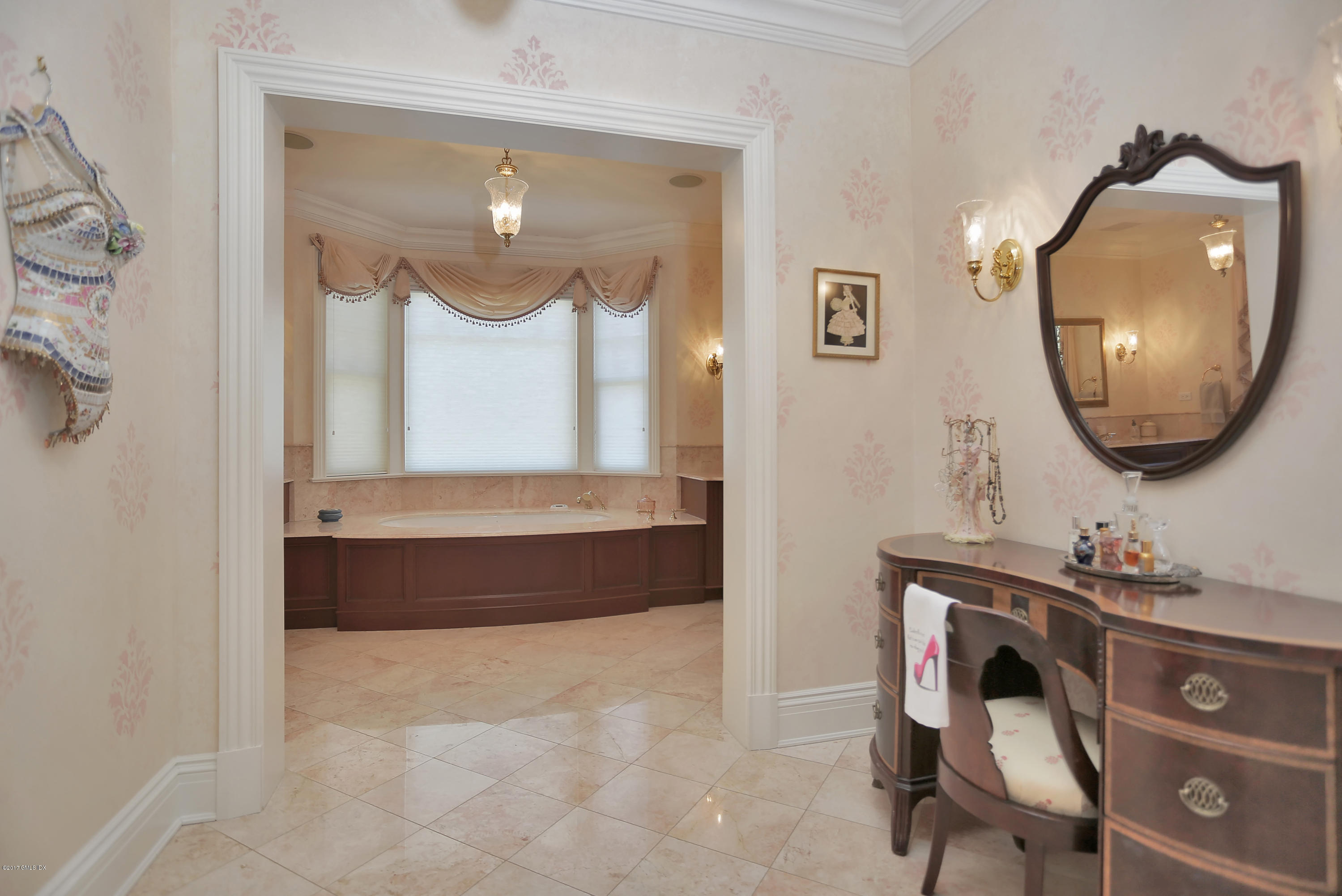 41 Leeward Lane Riverside, CT 06878 - Photo 16 of 27 a bathroom with a sink and a mirror