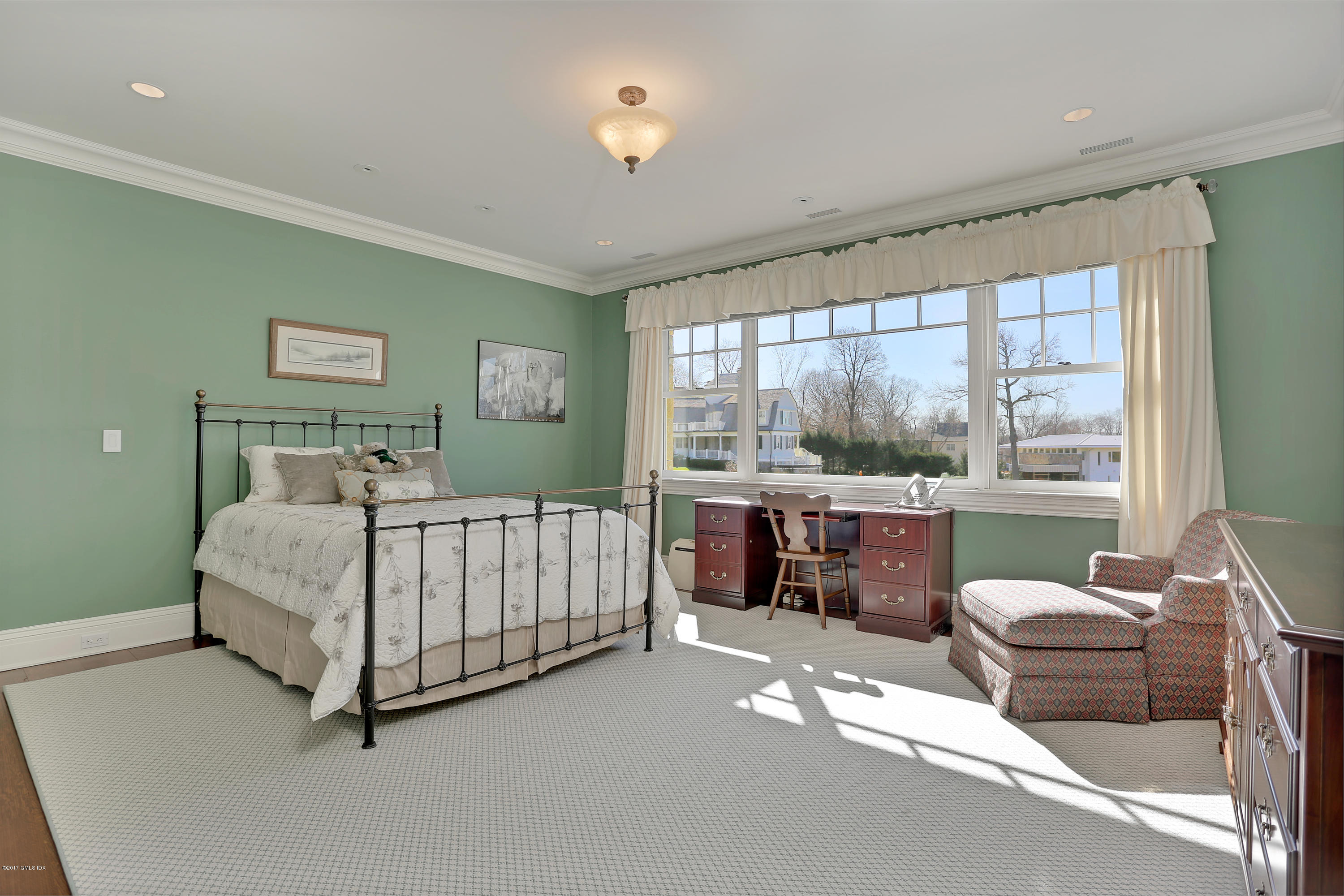 41 Leeward Lane Riverside, CT 06878 - Photo 18 of 27 a bedroom with a bed and a large window