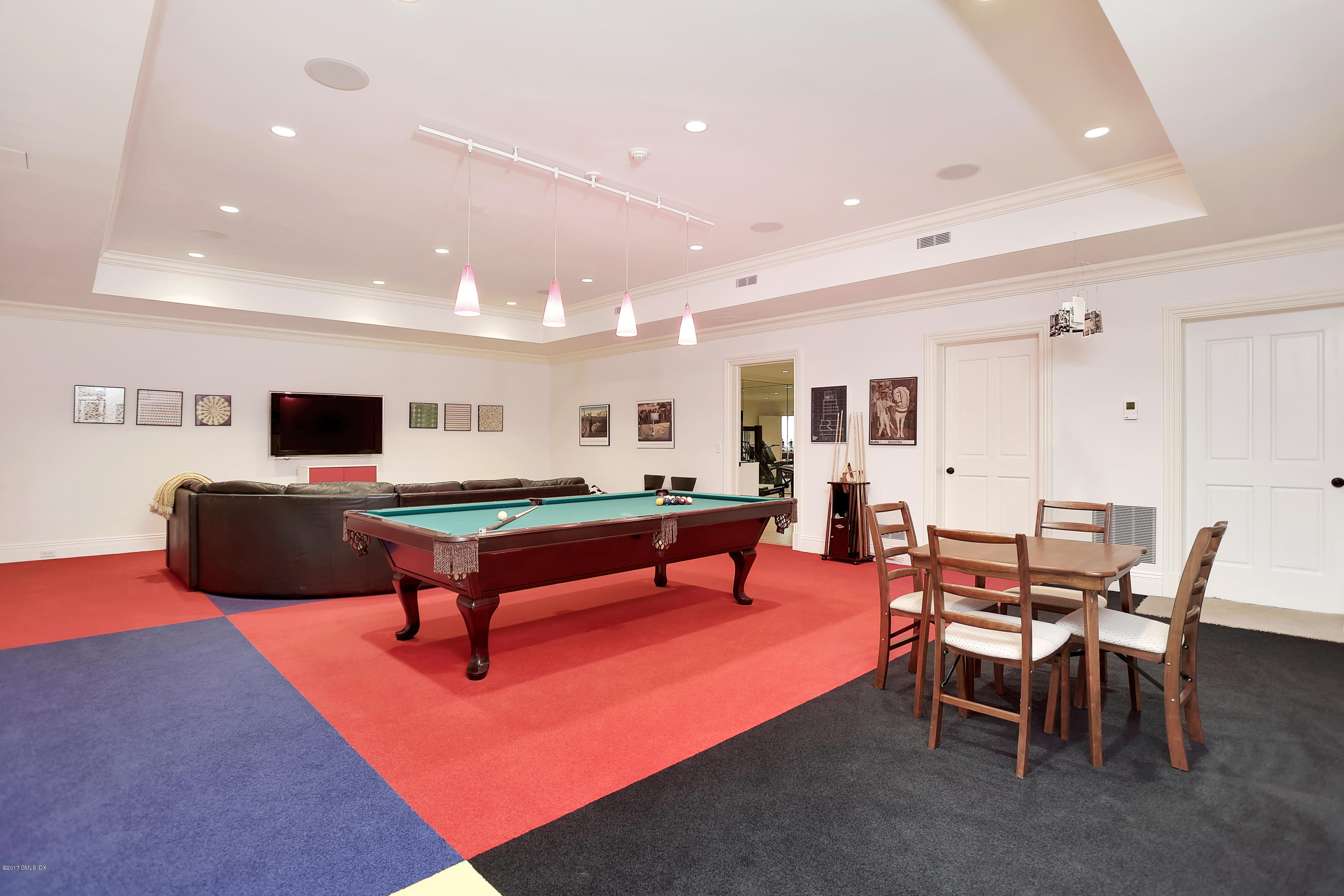 41 Leeward Lane Riverside, CT 06878 - Photo 23 of 27 a living room with furniture a table and a flat screen tv