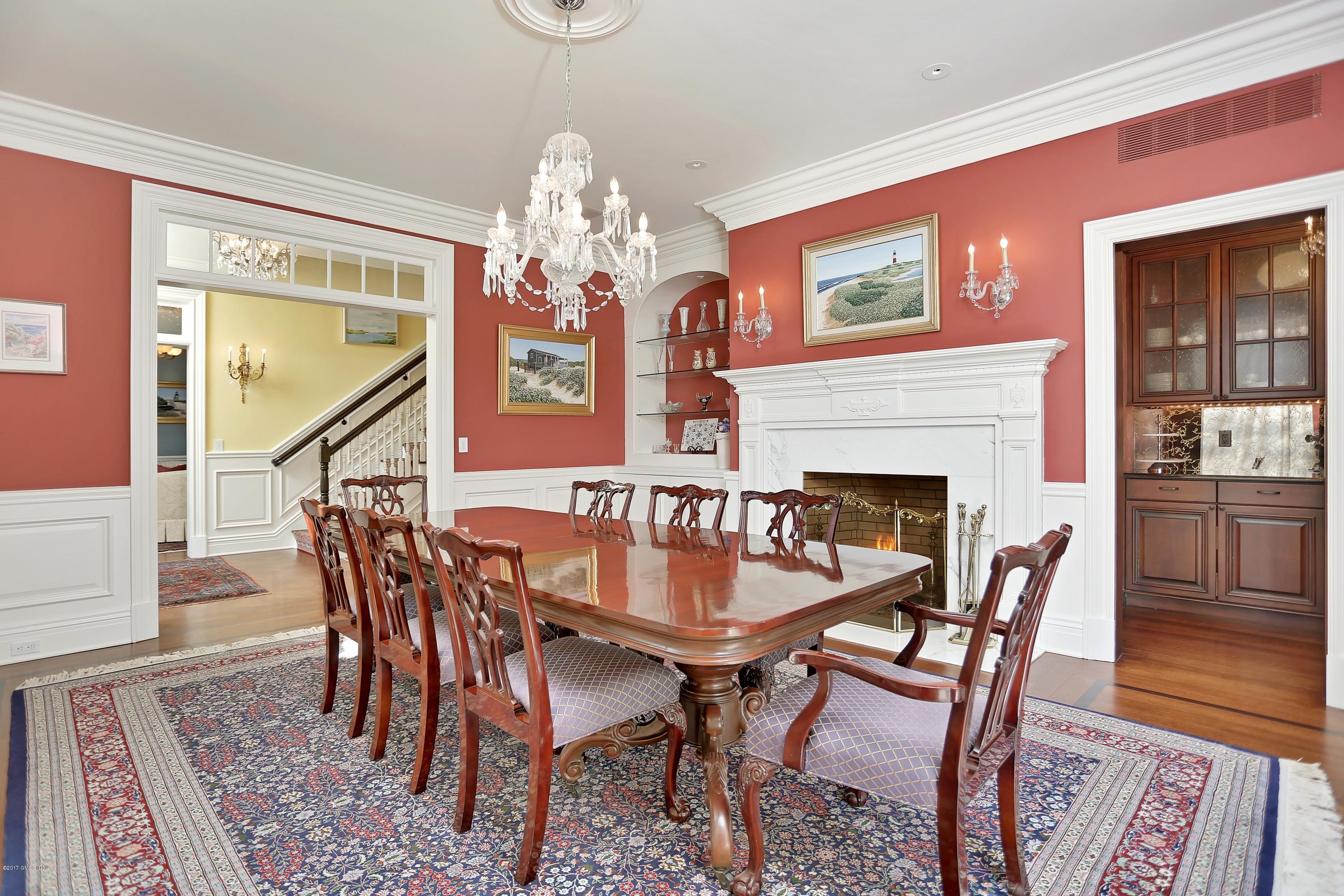 41 Leeward Lane Riverside, CT 06878 - Photo 7 of 27 a dining room with furniture a chandelier and wooden floor