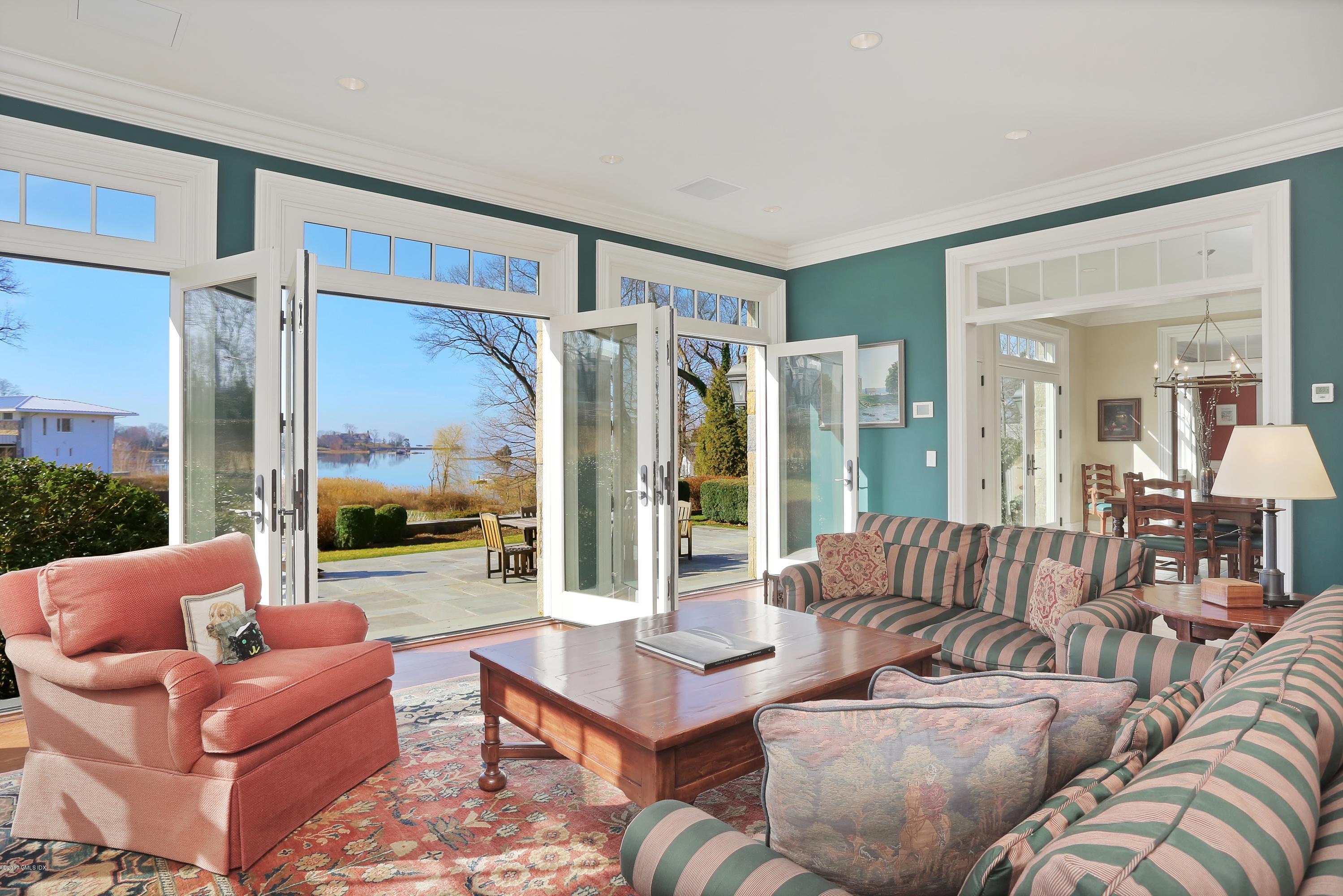 41 Leeward Lane Riverside, CT 06878 - Photo 10 of 27 a living room with furniture and a large window