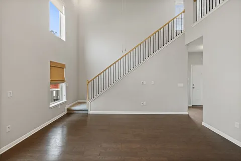 a view of an entryway with wooden floor