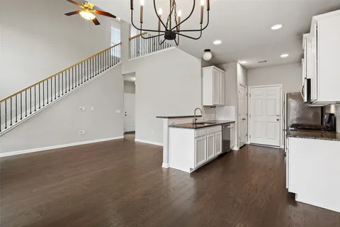 a view of kitchen with sink and stainless steel appliances