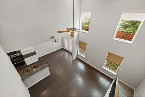 a view of workspace with wooden floor and windows