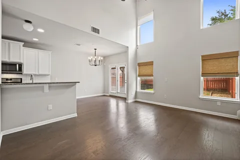 a view of a kitchen with a sink dishwasher and a refrigerator