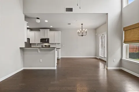 a view of a kitchen with electric appliances