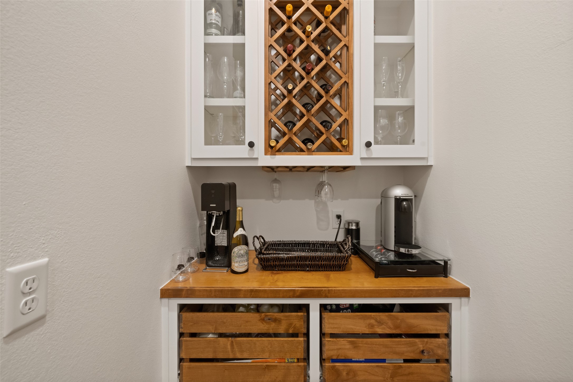27201 Double Culvert Road Hempstead, TX 77445 - Photo 7 of 49 Custom beverage station with built-in wine storage, glass-front cabinetry, and butcher block counters adds function and flair.