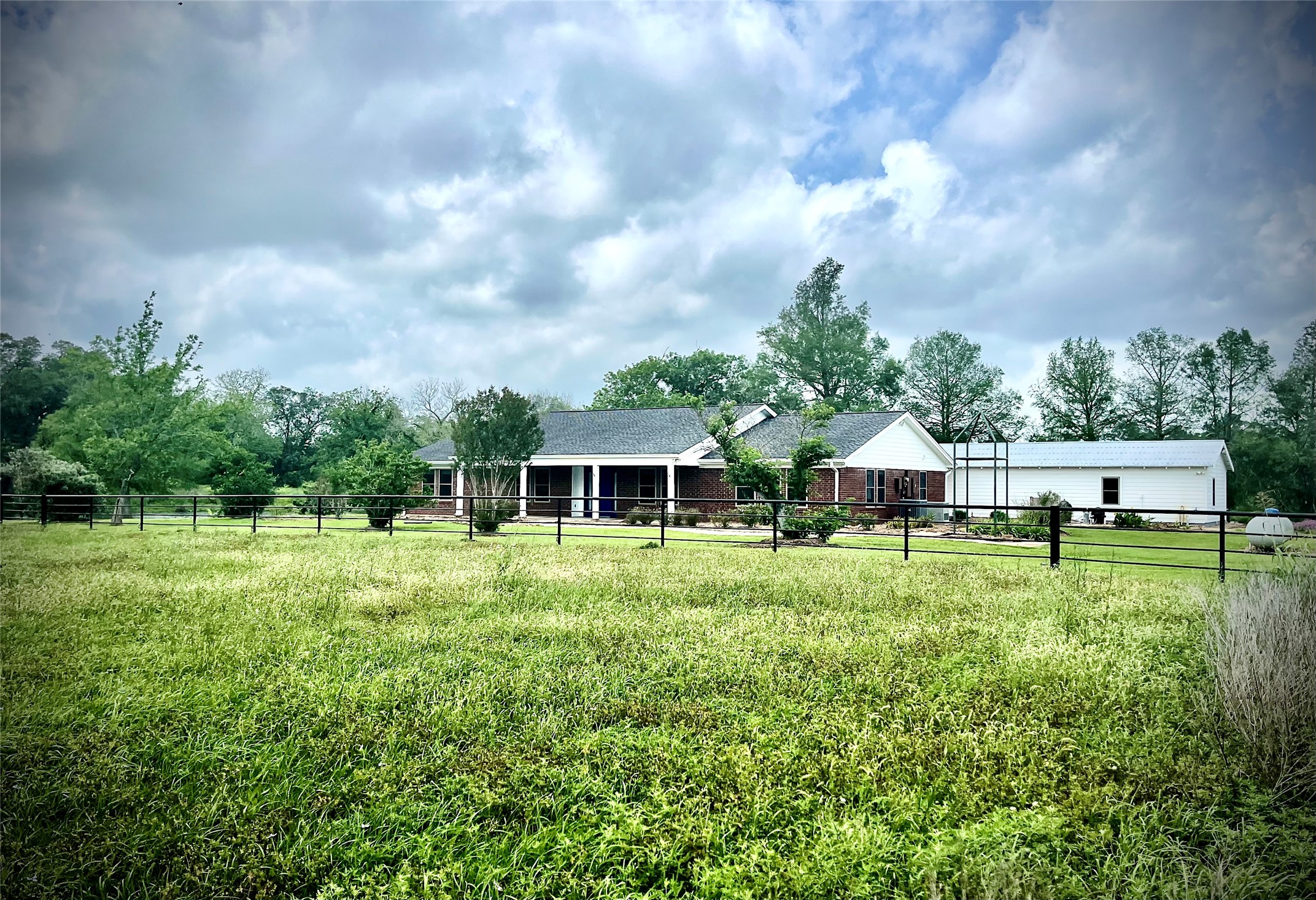 37243 FM 521 Road Bay City, TX 77414 - Photo 3 of 50 The yard fence is constructed of welded drill-stem pipe making it very strong!