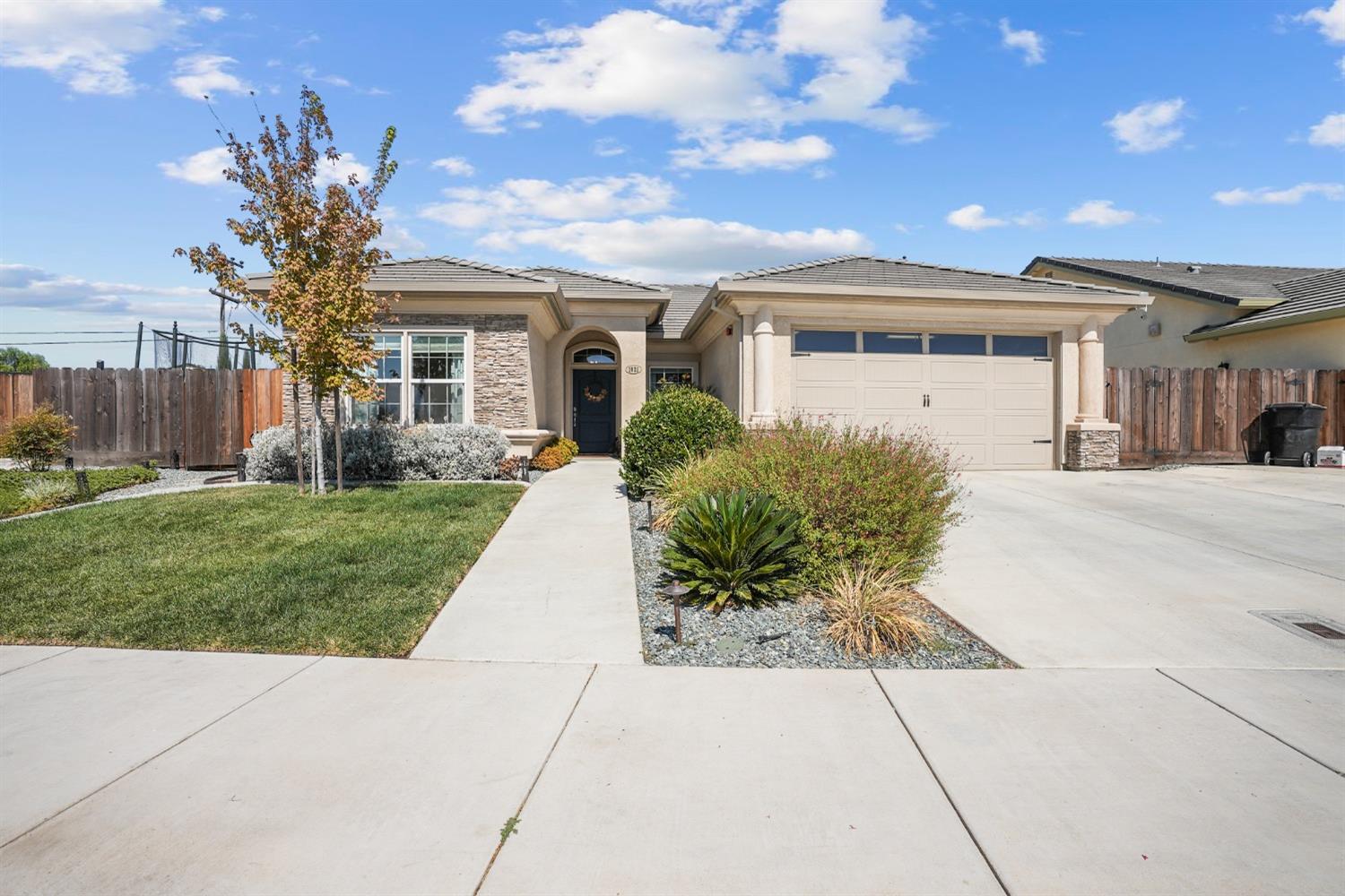 1021 Gabrielle Place Ripon, CA 95366 - Photo 1 of 1 a front view of house with yard and green space