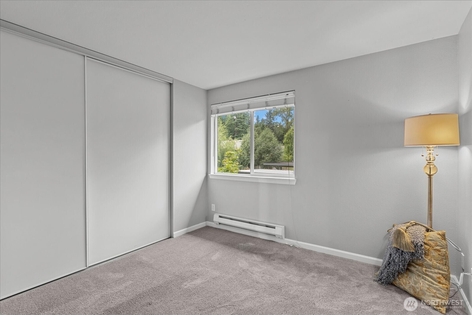 10831 Northeast 147th Lane, Unit R202 Bothell, WA 98011 - Photo 13 of 30 a room with a bed and a window