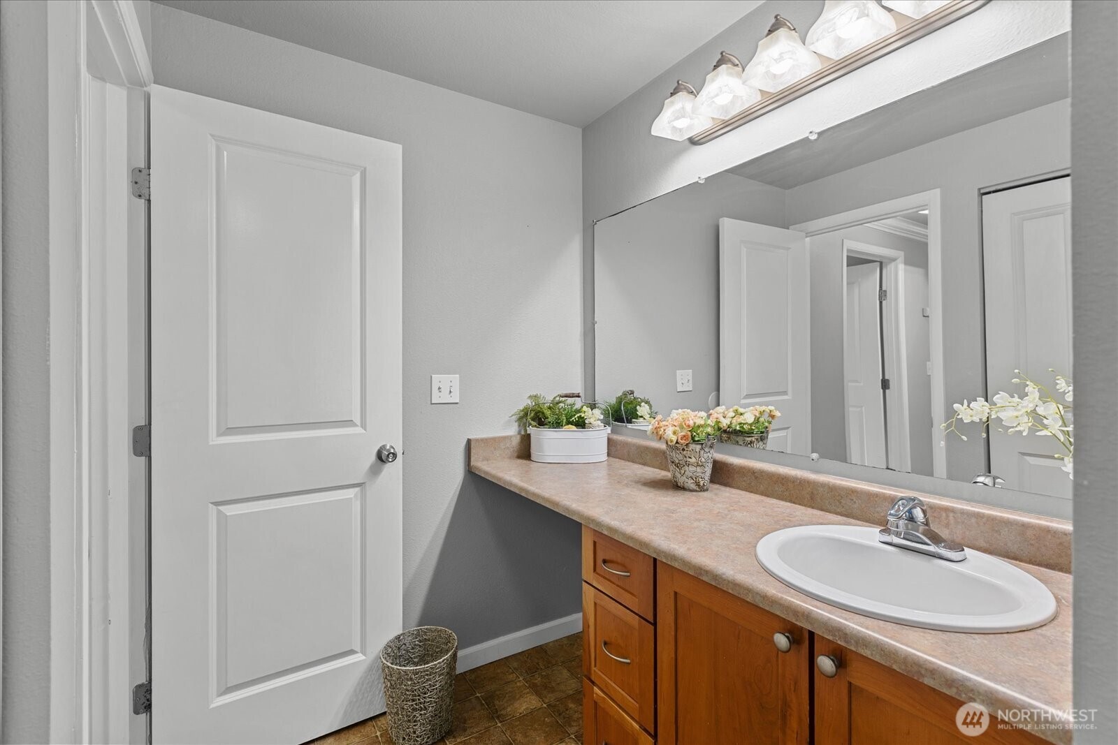 10831 Northeast 147th Lane, Unit R202 Bothell, WA 98011 - Photo 17 of 30 a bathroom with a double vanity sink and a mirror