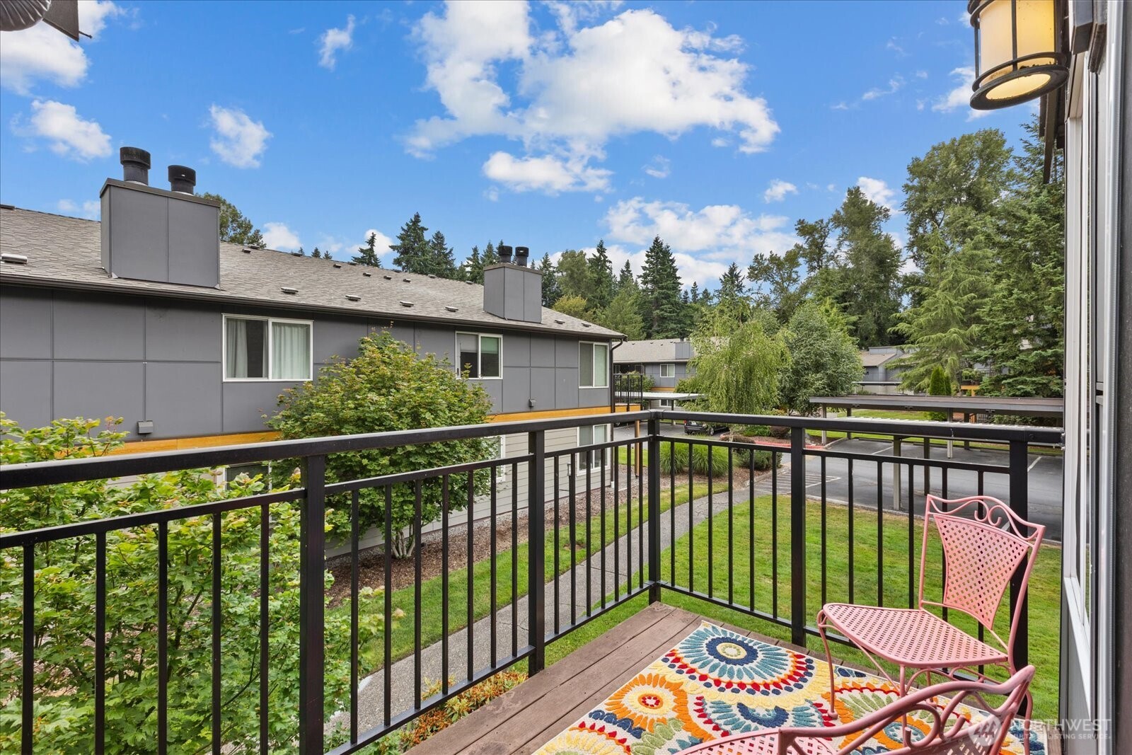 10831 Northeast 147th Lane, Unit R202 Bothell, WA 98011 - Photo 19 of 30 a view of a two chairs in the balcony