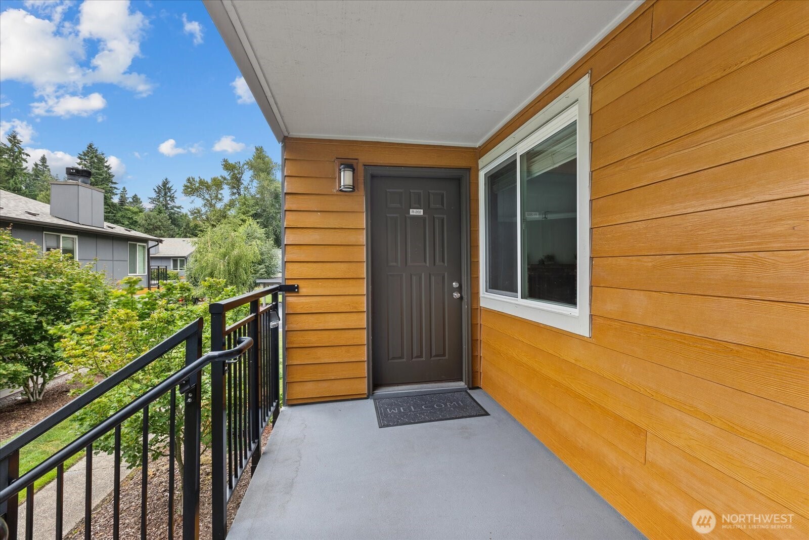 10831 Northeast 147th Lane, Unit R202 Bothell, WA 98011 - Photo 2 of 30 a view of balcony and yard