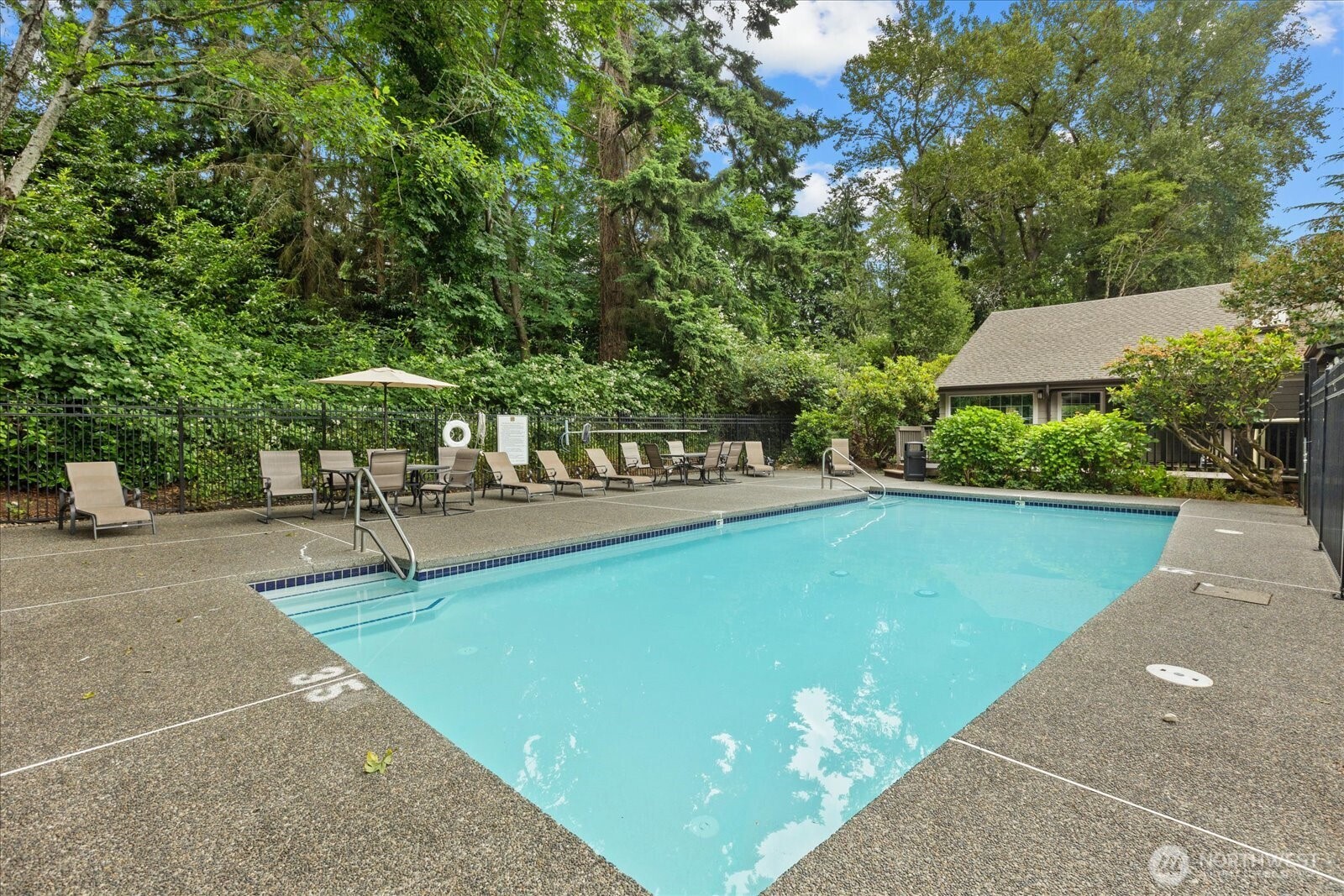 10831 Northeast 147th Lane, Unit R202 Bothell, WA 98011 - Photo 23 of 30 a view of a swimming pool with a patio