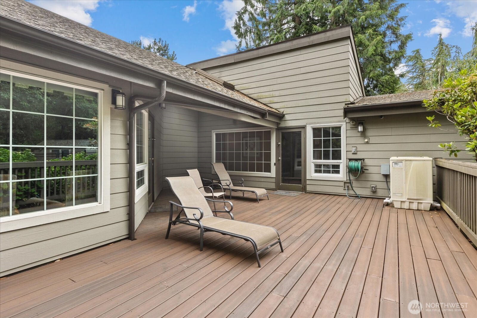 10831 Northeast 147th Lane, Unit R202 Bothell, WA 98011 - Photo 25 of 30 a balcony with wooden floor and furniture