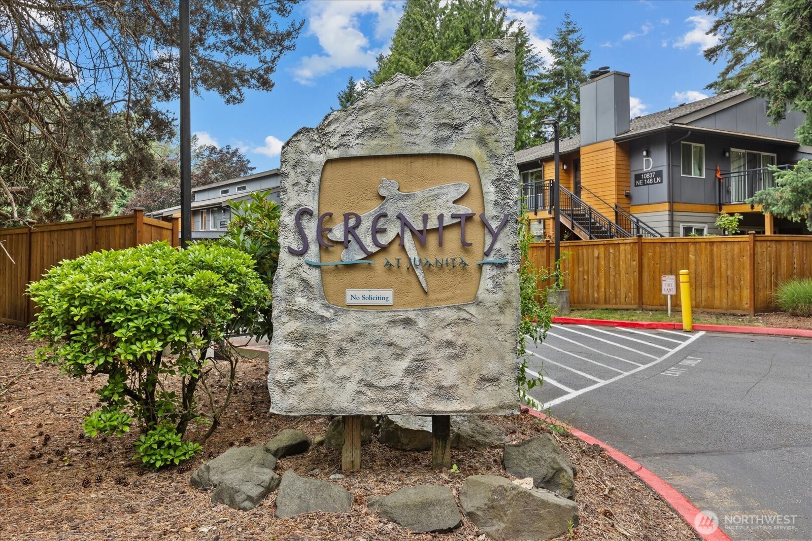 10831 Northeast 147th Lane, Unit R202 Bothell, WA 98011 - Photo 29 of 30 a sign board with buildings in the background