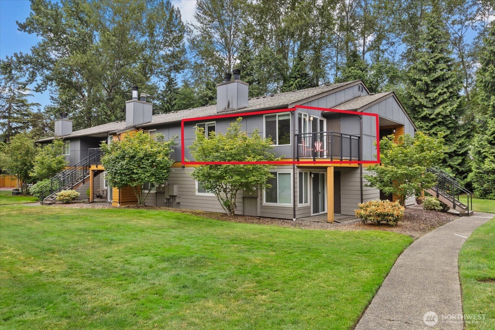 10831 Northeast 147th Lane, Unit R202 Bothell, WA 98011 - Photo 30 of 30 a front view of a house with a yard table and chairs