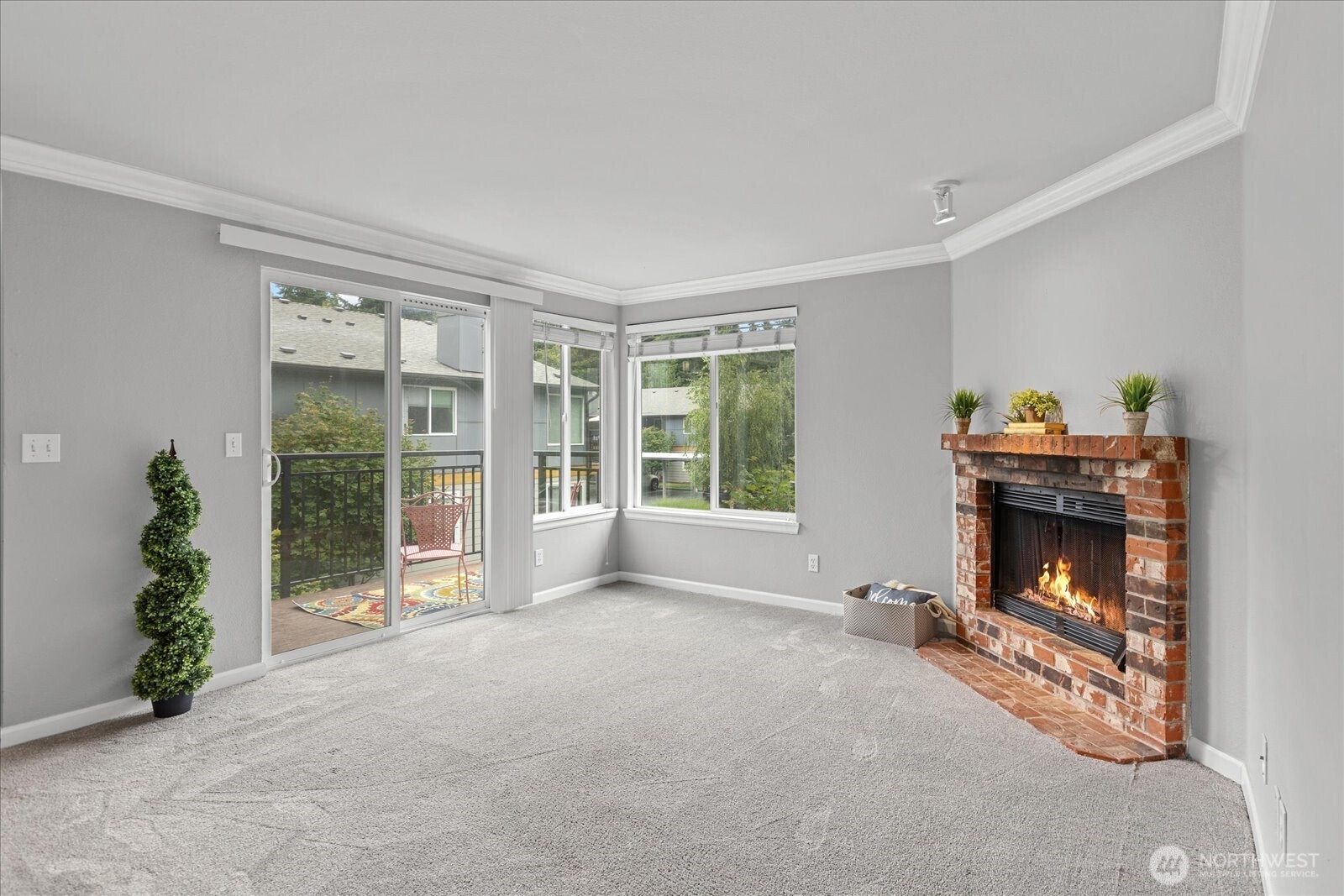 10831 Northeast 147th Lane, Unit R202 Bothell, WA 98011 - Photo 5 of 30 a living room with furniture and a fireplace