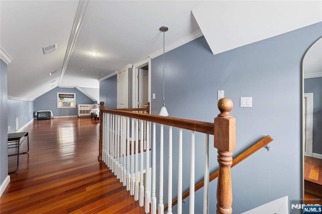 74 Spring Avenue Bergenfield, NJ 07621 - Photo 16 of 39 a view of entryway and hall with wooden floor