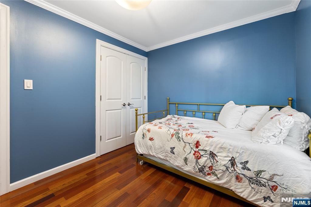74 Spring Avenue Bergenfield, NJ 07621 - Photo 18 of 39 a bedroom with a bed and window