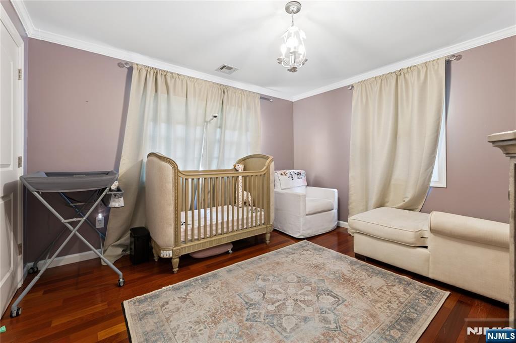 74 Spring Avenue Bergenfield, NJ 07621 - Photo 22 of 39 a living room with furniture and a window