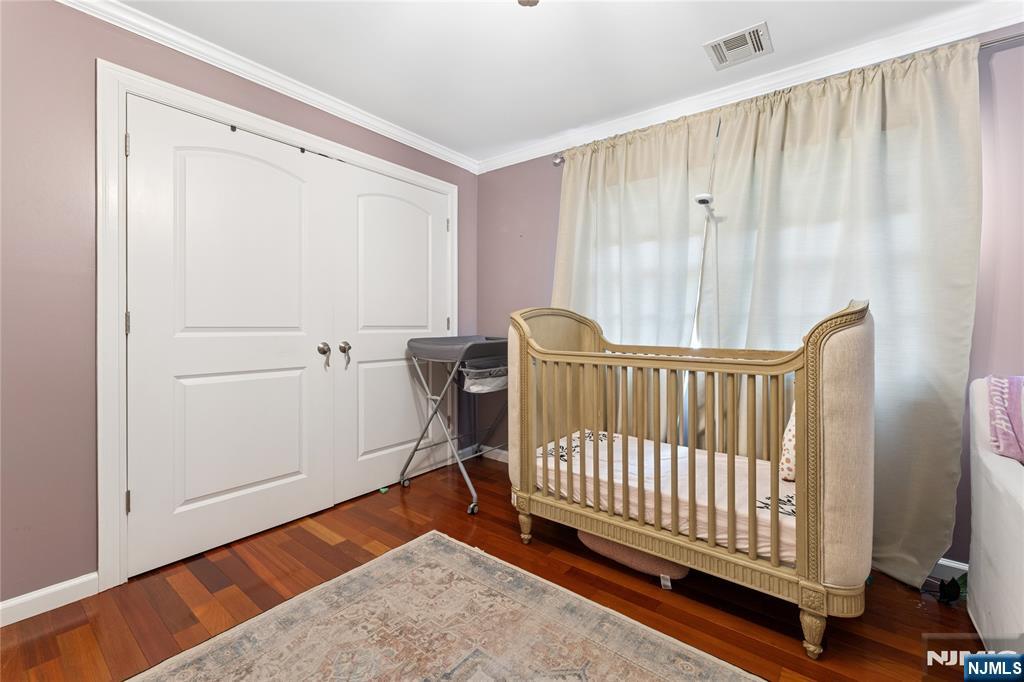 74 Spring Avenue Bergenfield, NJ 07621 - Photo 23 of 39 a view of a room with a wooden floor