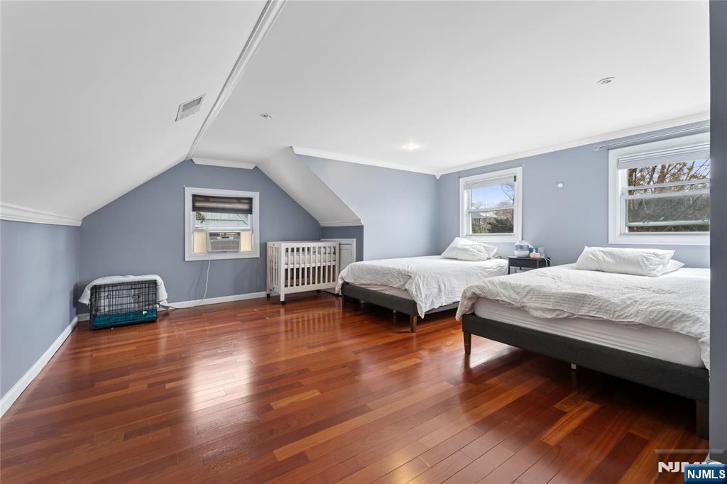 74 Spring Avenue Bergenfield, NJ 07621 - Photo 24 of 39 a bedroom with a bed and a chair