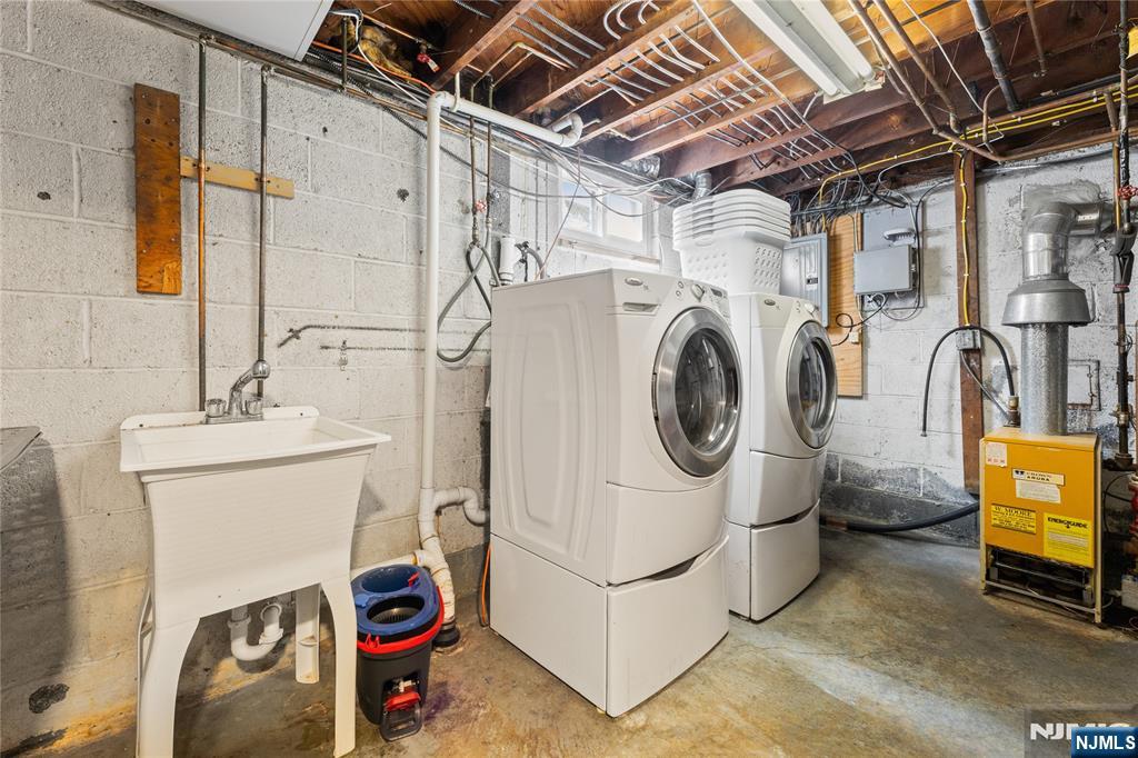 74 Spring Avenue Bergenfield, NJ 07621 - Photo 26 of 39 a utility room with dryer and washer