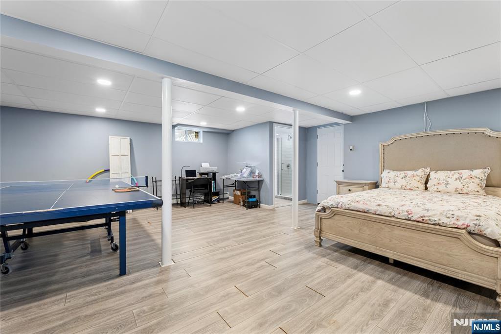 74 Spring Avenue Bergenfield, NJ 07621 - Photo 30 of 39 a bedroom with furniture and a wooden floor