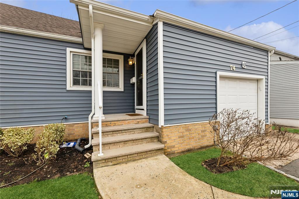74 Spring Avenue Bergenfield, NJ 07621 - Photo 3 of 39 a view of a house with backyard and a garden