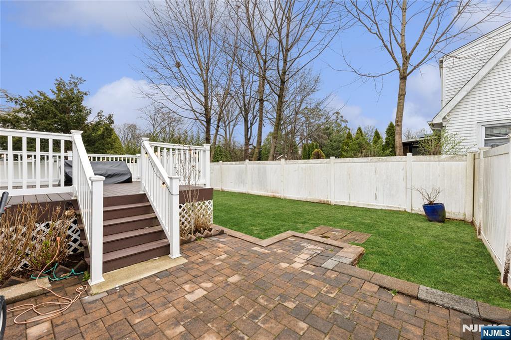 74 Spring Avenue Bergenfield, NJ 07621 - Photo 33 of 39 a view of backyard with deck
