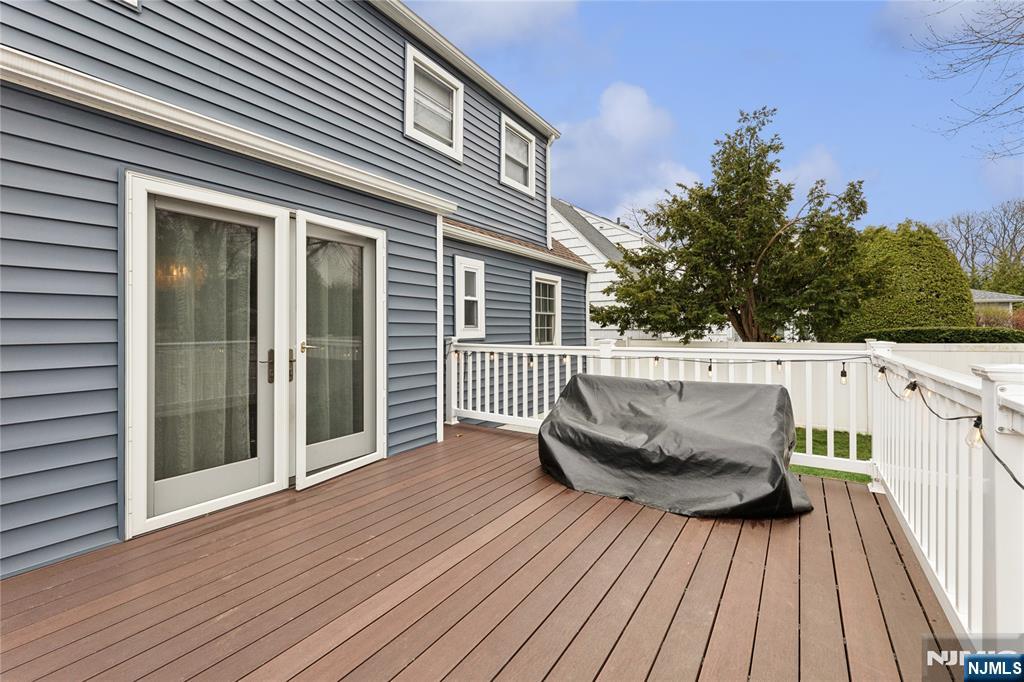 74 Spring Avenue Bergenfield, NJ 07621 - Photo 37 of 39 a view of a house with a wooden deck