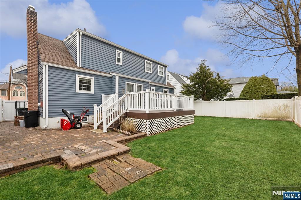 74 Spring Avenue Bergenfield, NJ 07621 - Photo 38 of 39 a view of backyard with a garden and deck
