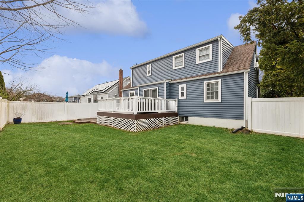 74 Spring Avenue Bergenfield, NJ 07621 - Photo 39 of 39 a house view with a garden space