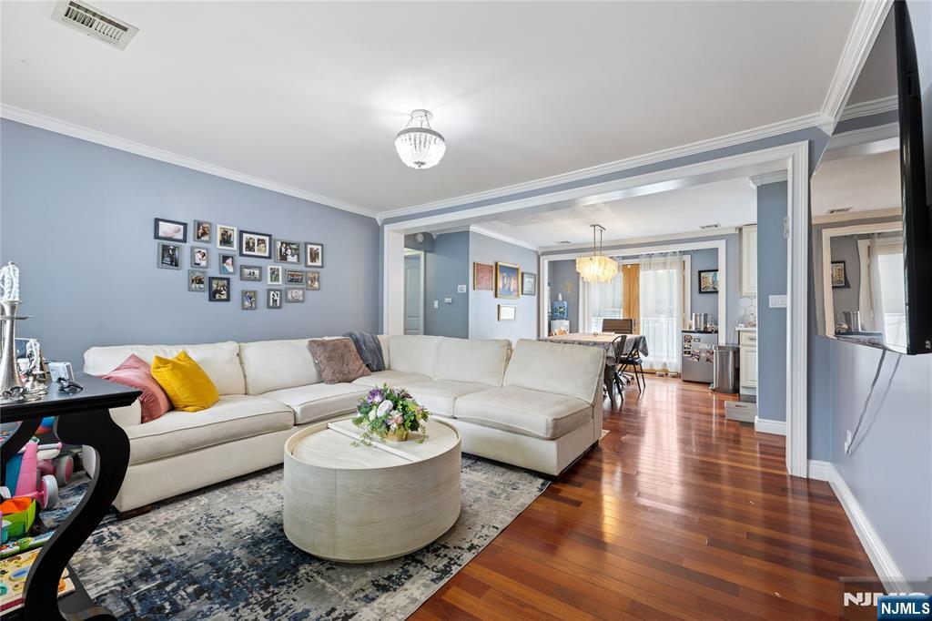 74 Spring Avenue Bergenfield, NJ 07621 - Photo 5 of 39 a living room with furniture and wooden floor