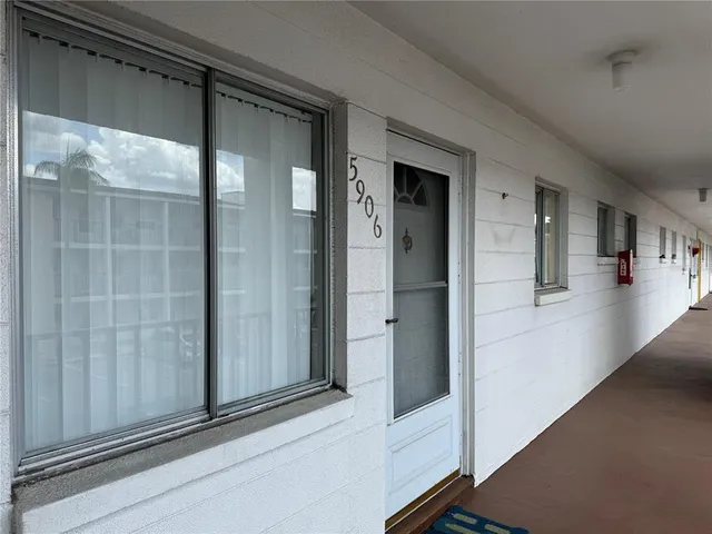 a view of a hallway view with staircase