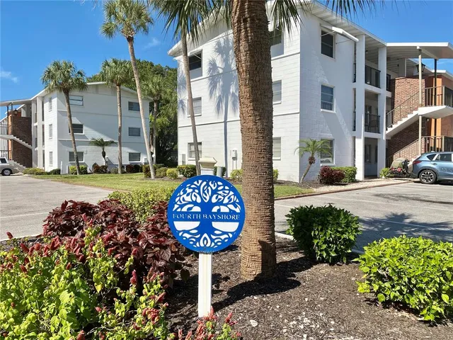 a front view of a building with garden