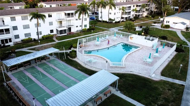 a view of a patio with chairs and a table