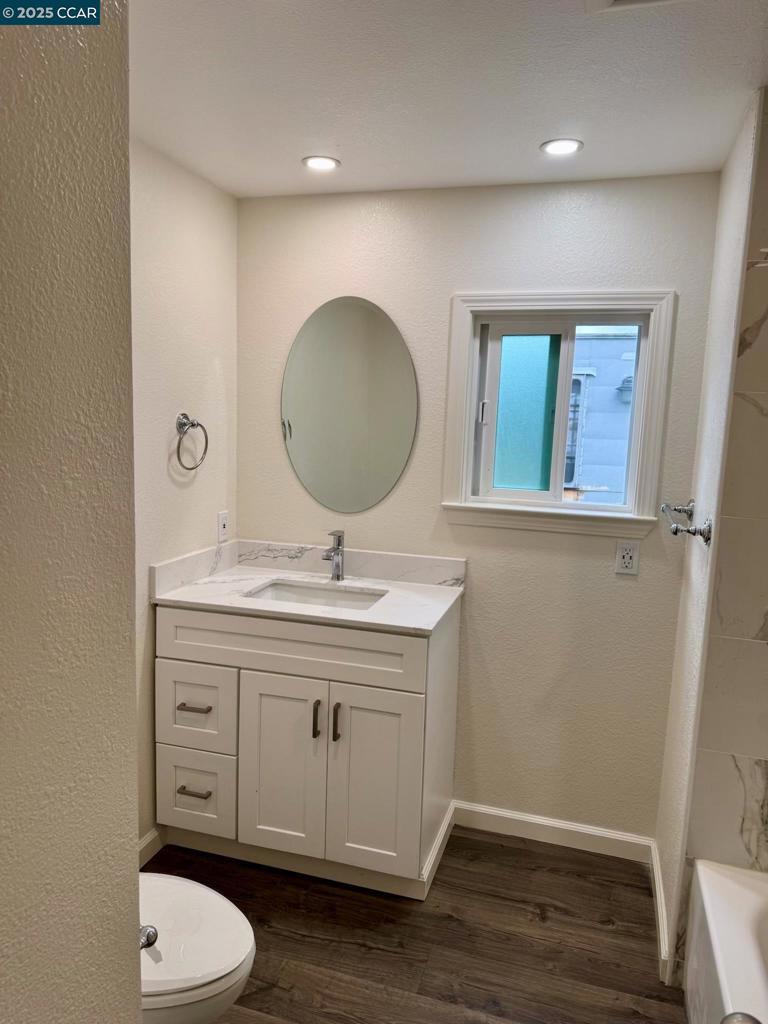 747 Lewelling Boulevard San Leandro, CA 94579 - Photo 12 of 14 a bathroom with a toilet a sink and mirror
