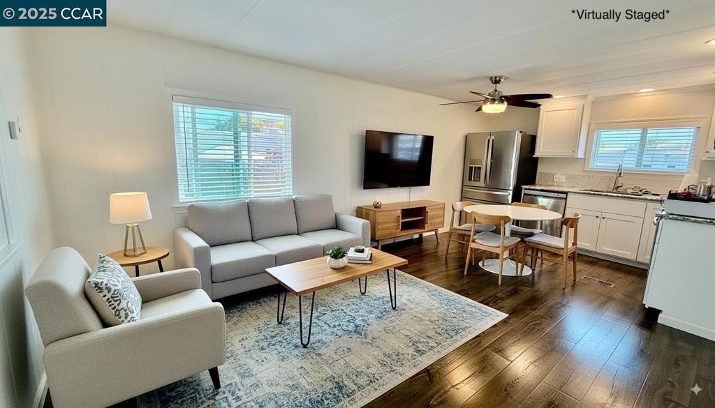 747 Lewelling Boulevard San Leandro, CA 94579 - Photo 3 of 14 a living room with furniture and a flat screen tv