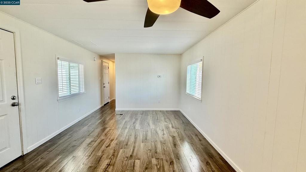 747 Lewelling Boulevard San Leandro, CA 94579 - Photo 5 of 14 a view of an empty room with wooden floor and a window