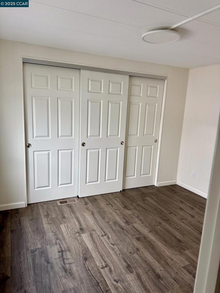 747 Lewelling Boulevard San Leandro, CA 94579 - Photo 7 of 14 a view of empty room with wooden floor