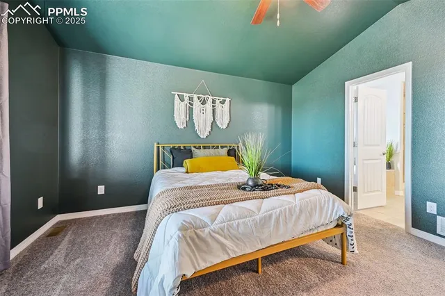 a bedroom with a bed and lamp