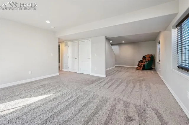 a view of a big room with wooden floor and furniture