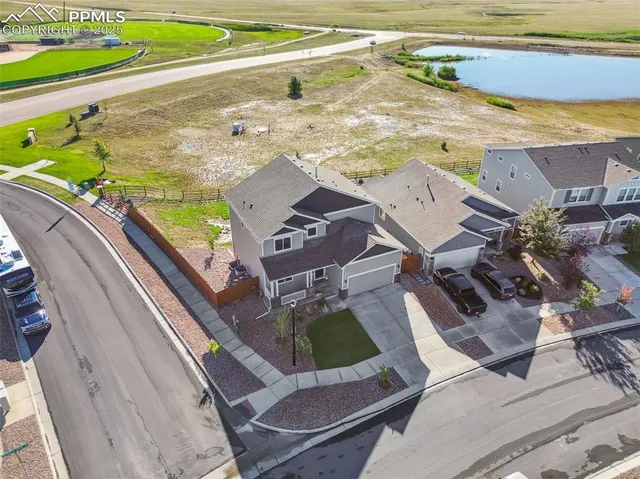 a view of a swimming pool with a lawn chairs