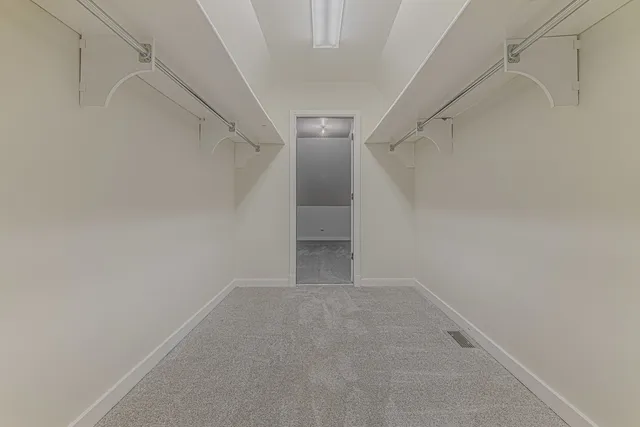 a view of an empty walk in closet