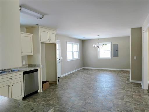 397 Lone Star Road Lawrenceburg, TN 38464 - Photo 7 of 13 a view of a kitchen with refrigerator and window