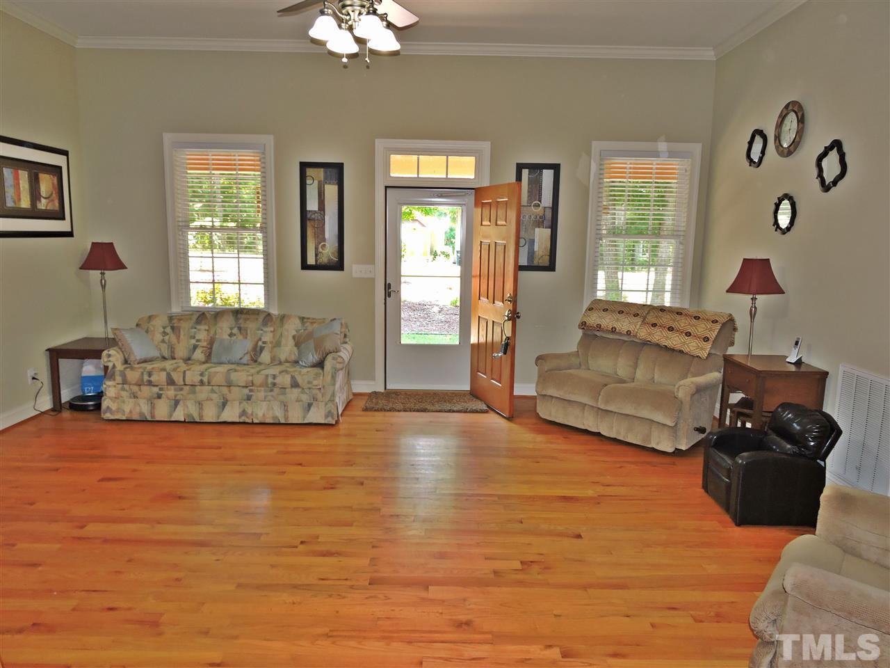 174 Weaver Ridge Road Rougemont, NC 27572 - Photo 15 of 25 a living room with furniture and a flat screen tv