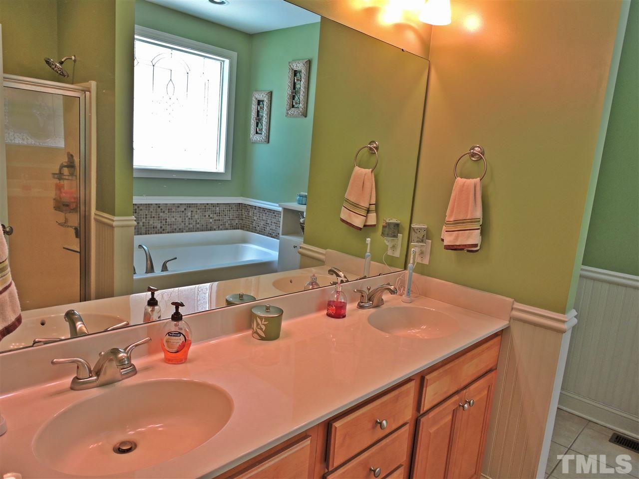 174 Weaver Ridge Road Rougemont, NC 27572 - Photo 17 of 25 a bathroom with a sink and a mirror